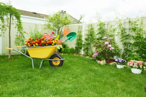 Team member using equipment carefully in a garden